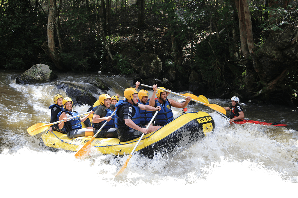 people enjoying water rafting